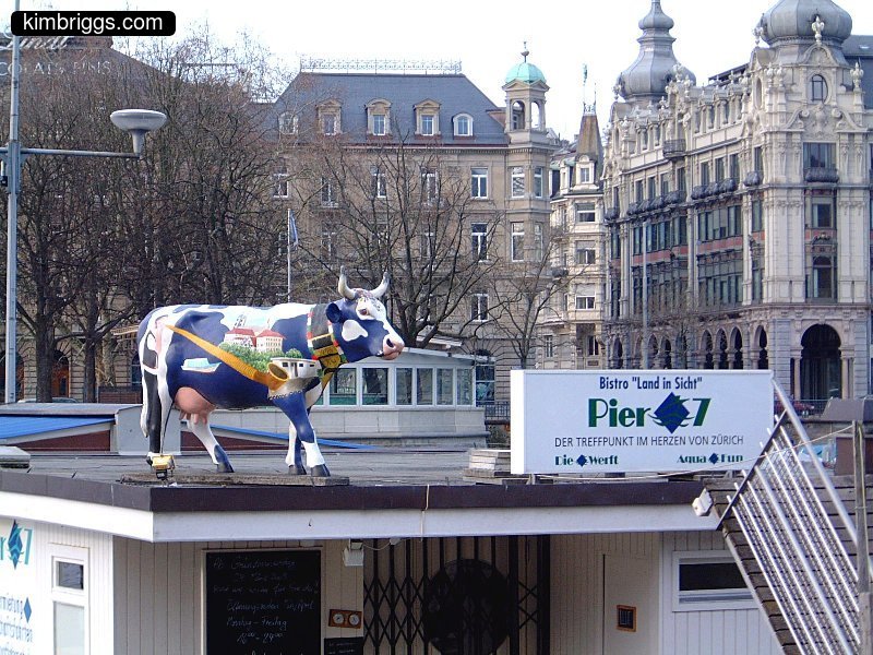 Painted statue of a cow.